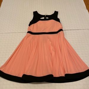 Black and blush pink dress with pleated skirt